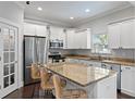 Beautiful kitchen with stainless steel appliances, granite countertops, and a breakfast bar with seating at 3620 W San Pedro St, Tampa, FL 33629