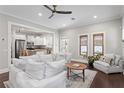 Bright living room showcasing an open floor plan with hardwood floors and modern furnishings at 3620 W San Pedro St, Tampa, FL 33629