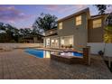Gorgeous backyard with a sparkling pool, hot tub, and covered patio perfect for outdoor entertaining at 4515 W Leona St, Tampa, FL 33629