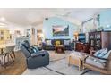 Comfortable living room with a view of the kitchen and dining area, showcasing open-concept living at 526 5Th N Ave, Safety Harbor, FL 34695