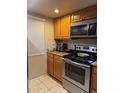 Kitchen featuring stainless steel appliances and plenty of cabinet space at 8105 Sheldon Shores Dr, Tampa, FL 33615