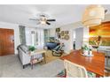 Inviting living room featuring a ceiling fan, stylish furniture, and lots of natural light at 11376 119Th Ter, Largo, FL 33778