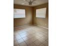 Neutral bedroom with tiled flooring, ceiling fan and two windows providing ample light at 1427 15Th S St, St Petersburg, FL 33705