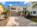 Attractive two-story home with a long driveway and a cozy front porch at 1520 W Fig St, Tampa, FL 33606