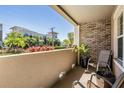 Cozy balcony featuring brick accents, plants, chairs and an open view at 1543 W Cass St, Tampa, FL 33606