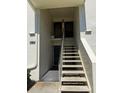 Close up of the entrance to unit 210, 212 with stairs at 210 Cypress Ct # 122, Oldsmar, FL 34677