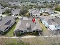 Overhead view of the light yellow home showcasing its well-maintained landscaping and community setting at 215 Sela Cove Cir, Apollo Beach, FL 33572