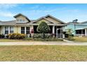 Charming home with a screened porch and colorful landscaping, offering great curb appeal at 215 Sela Cove Cir, Apollo Beach, FL 33572