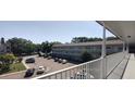 Balcony view of the condo complex showing the parking lot and building exterior at 2261 Swedish Dr # 59, Clearwater, FL 33763