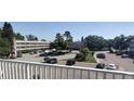 A view of the condominiums from a balcony with a view of the parking area at 2261 Swedish Dr # 59, Clearwater, FL 33763
