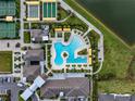 Stunning aerial view of the resort-style amenities including a pool and sports courts at 31510 Cabana Rye Ave, San Antonio, FL 33576