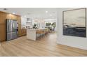 Open concept kitchen with a large center island, modern appliances, and stylish pendant lighting at 3801 Dr Martin Luther King Jr N St, St Petersburg, FL 33703