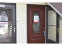 Close-up of dark front door of unit 424, one of three units in the building at 420 Moorings Cove Dr # 420, Tarpon Springs, FL 34689