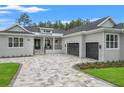 Beautiful single-story home with a paved driveway and two-car garage, showcasing excellent curb appeal at 4522 Majestic Hills Loop, Brooksville, FL 34601