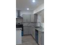 Stylish kitchen with stainless steel appliances, granite countertops, and soft-close cabinetry at 4824 Huntington Ne St, St Petersburg, FL 33703