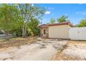 Cozy single-story home featuring a well-maintained lawn and convenient driveway, under a bright, sunny sky at 6982 78Th N Ave, Pinellas Park, FL 33781