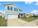 Two-story home with a spacious driveway and well-maintained lawn at 3509 San Moise St, Plant City, FL 33567