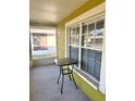 Relaxing front porch with table and view of the yard, perfect for morning coffee at 10411 Summerview Cir, Riverview, FL 33578