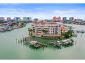 Waterfront condominium featuring a private pool, docks, and stunning water views with nearby city skyline at 205 Brightwater Dr # 101, Clearwater Beach, FL 33767
