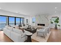 Bright living room with ocean view, modern fireplace, hardwood floors and comfortable seating at 2087 Michigan Ne Ave, St Petersburg, FL 33703