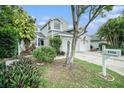 Inviting townhome with neatly kept landscaping, a visible mailbox, and a two-car driveway at 2456 Alhambra St, Clearwater, FL 33761