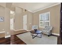 Cozy living room with hardwood floors, plantation shutters, and comfortable seating, creating an inviting space at 2614 Brookforest Dr, Wesley Chapel, FL 33544