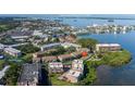 Scenic aerial view of the waterfront condos and a glimpse of Clearwater Beach and Downtown Dunedin at 2750 Reserve Ct # 101, Dunedin, FL 34698