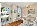 Cozy dining area with wood floors and view of the front yard at 30140 Barnaby Ln, Wesley Chapel, FL 33543