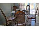Cozy dining area with seating for four and views of the backyard at 3026 19Th Sw Pl, Largo, FL 33774