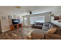 Comfortable living room with a large sectional sofa and stylish decor at 39772 Meadowood Loop, Zephyrhills, FL 33542