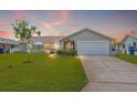 Charming single-story home with a well-manicured lawn, mature trees and a two-car garage, perfect for a small Gathering at 5208 Denver Ne St, St Petersburg, FL 33703