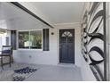Inviting front porch with stylish decor and a cozy seating area at 5413 15Th Ave S, Gulfport, FL 33707