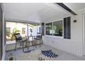 Relaxing screened patio with a seating area, perfect for enjoying the outdoors at 5413 15Th Ave S, Gulfport, FL 33707