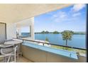 Relaxing balcony view overlooking serene waters and lush landscaping, perfect for enjoying outdoor living at 5915 Sea Ranch Dr # 202, Hudson, FL 34667