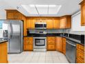 Well-equipped kitchen featuring stainless steel appliances, granite countertops, and ample cabinet space at 5915 Sea Ranch Dr # 202, Hudson, FL 34667