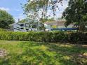 Backyard featuring a RV camper with a manicured hedge providing privacy at 6317 Buster Dr, Tampa, FL 33619