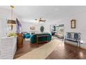 Spacious living room featuring elegant flooring, modern lighting, and an open layout perfect for entertaining at 6801 Pinellas Point S Dr, St Petersburg, FL 33712