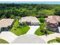 Expansive aerial view showcasing the meticulously maintained lawn and curb appeal of this home at 6933 Cozumel Ct, Land O Lakes, FL 34637