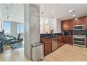 Modern kitchen with stainless steel appliances, dark counters, and a concrete column at 777 N Ashley Dr # 3009, Tampa, FL 33602