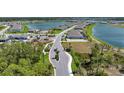 Expansive aerial view of a Primary-planned community with multiple lakes and new construction homes at 8589 Saint Kitts Cir, Englewood, FL 34224