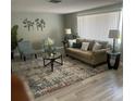 Inviting living room with a neutral color palette, comfortable seating, and elegant decor at 12415 Stagecoach Ln, Hudson, FL 34667