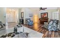 Comfortable living area with hardwood floors, stylish decor, and plenty of natural light at 3105 Avocet Pl, Safety Harbor, FL 34695