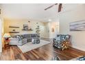 Spacious living area boasting hardwood floors, plush seating, and abundant natural light at 3105 Avocet Pl, Safety Harbor, FL 34695