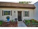 Inviting condo featuring a cozy front patio with manicured landscaping and charming curb appeal at 3126 Highlands Blvd # 3126, Palm Harbor, FL 34684