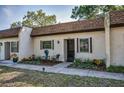 Inviting condo featuring a cozy front patio with manicured landscaping and charming curb appeal at 3126 Highlands Blvd # 3126, Palm Harbor, FL 34684