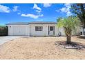 Charming single-story home featuring a one car garage, well-maintained landscaping, and a cozy front porch at 3247 Kimberly Oaks Dr, Holiday, FL 34691
