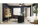 Stylish home office featuring dark blue walls, modern furniture, and a cozy seating area at 3475 Silent Gardens Cv, Wesley Chapel, FL 33543