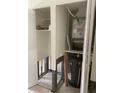 Utility closet with hot water heater and exposed infrastructure, ready for a remodel at 3514 Gulf # 2, St Petersburg, FL 33706