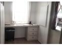 A functional office space with built-in desk, drawers, and window at 37648 Campo Ave, Zephyrhills, FL 33541