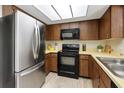 Well-equipped kitchen features stainless steel appliances and ample cabinet space for convenient storage at 4006 Cypress Lane #4006 # 4006, Tampa, FL 33618